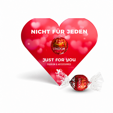 Rote bedruckte Herzkarte mit Lindor-Kugel und einzeln verpackter roter Lindor-Kugel