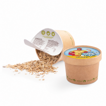 Müesli im Kraftpapierbecher mit individuell bedrucktem Deckel und sichtbarer Müeslimischung